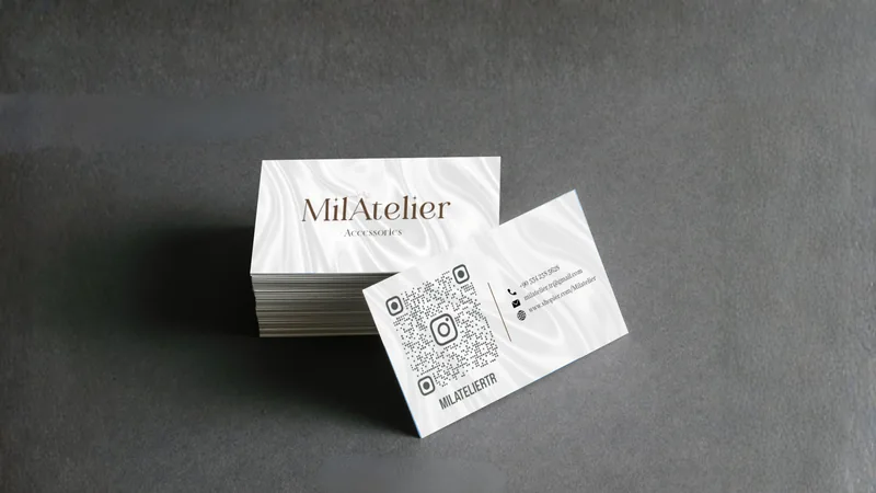 MilAtelier accessories business card, front and back